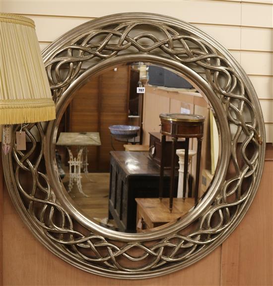 A carved pierced wood framed circular mirror W.107cm